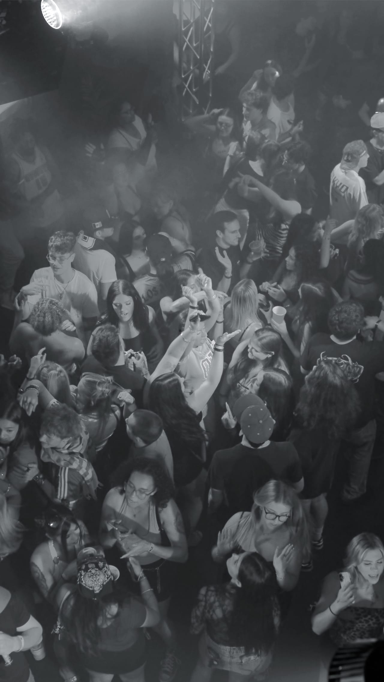 An overhead view of a full room at CTRL during a Saturday show, haze catching the moving lights above the crowd.