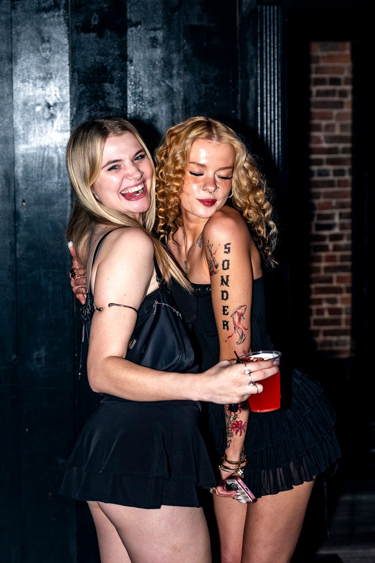 Two guests laughing together on a Latin Thursday at CTRL in downtown Springfield, Missouri.
